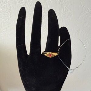 Elegant Gold Ring with Red Gemstone